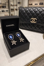 Crystal Star Drop Earrings with Blue Stone Accent