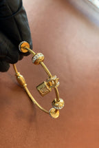 Luxury Gold Charm Bracelet with Lock Pendant – Elegant Crystal Bead Bangle